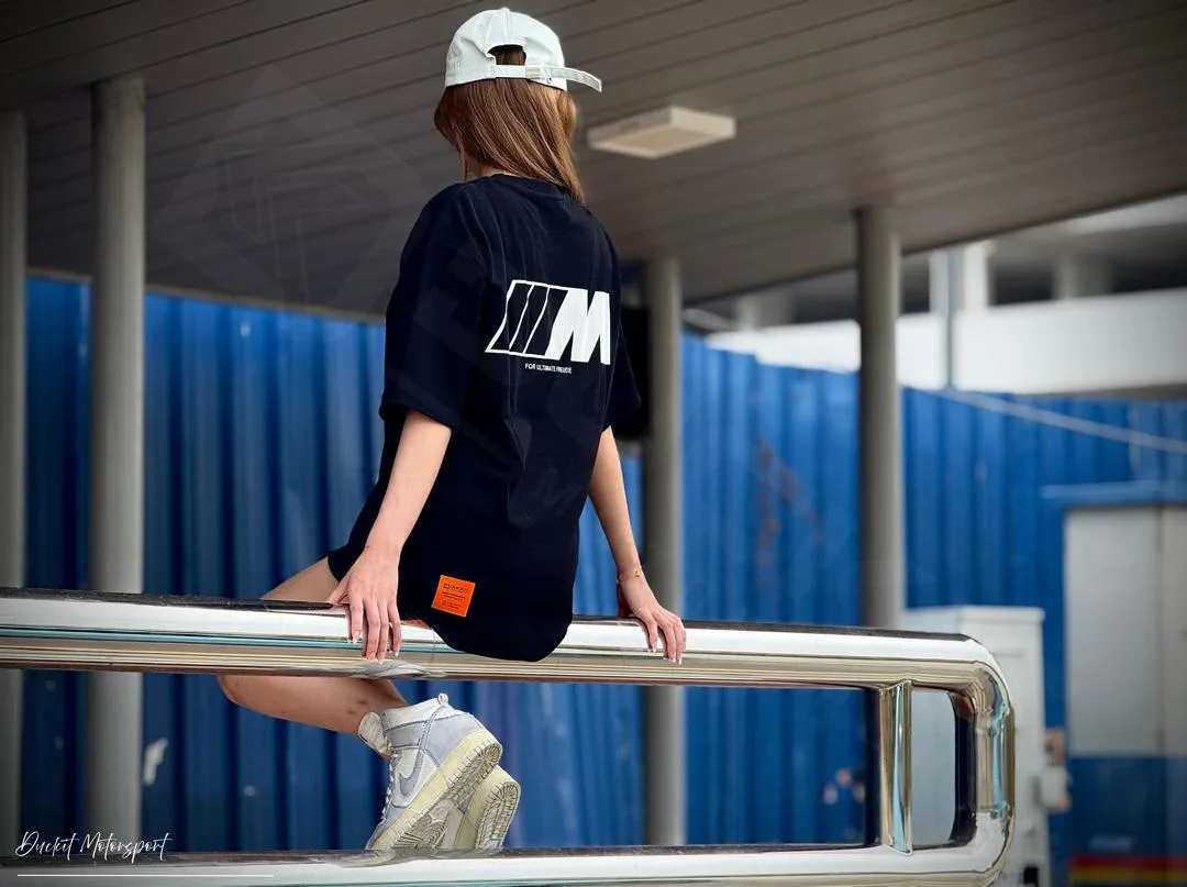 The Duckit oversized tee, back print, worn at the workshop